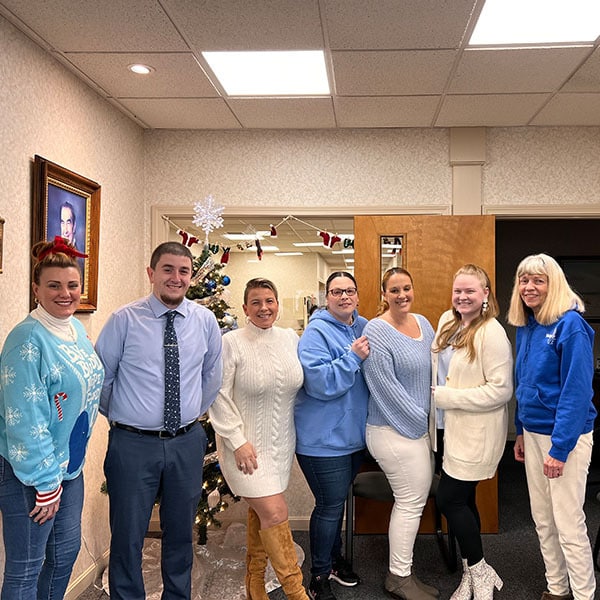 Careers-04 Team in blue and white winter outfits