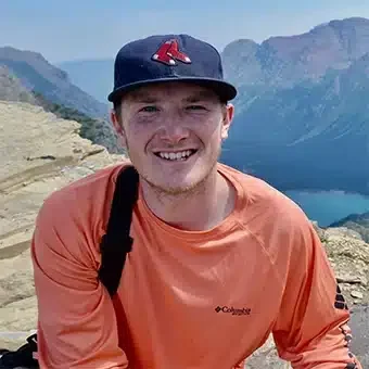 Smiling man with mountain view in the background