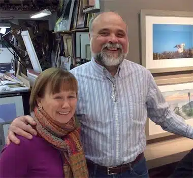 Smiling couple standing together indoors