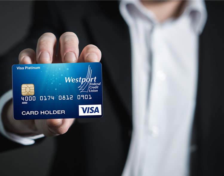 Man holding Westport Federal Visa card